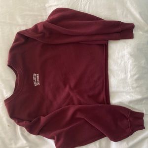Size S. Dark red sweater.